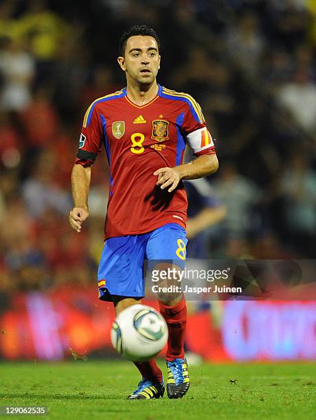 Xavi Hernandez of Spain in action during the UEFA EURO 2012 Group I Qualifier between Spain and Scotland at the Rico Perez stadium on October 11,...