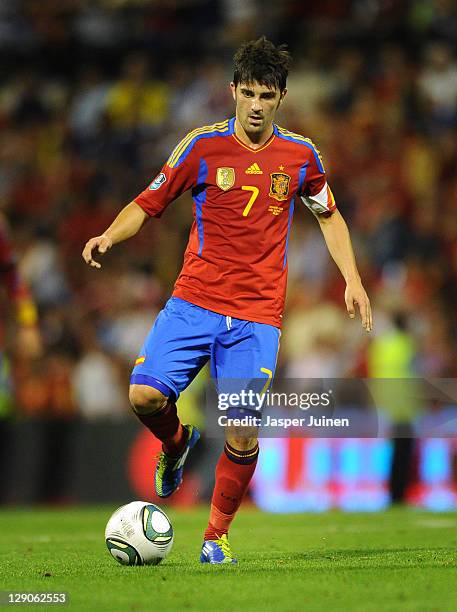 David Villa of Spain controls the ball during the UEFA EURO 2012 Group I Qualifier between Spain and Scotland at the Rico Perez stadium on October...