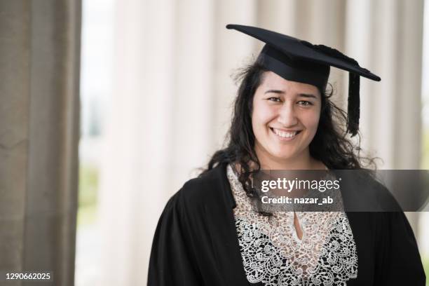 maori woman with smile on her face freshly graduated. - māori stock pictures, royalty-free photos & images