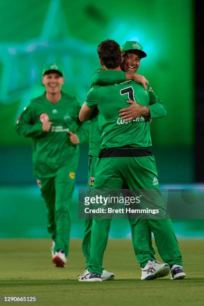 Nathan Coulter-Nile of the Stars celebrates with team mates after taking the wicket of Jack Wood of the Heat during the Big Bash League match between...