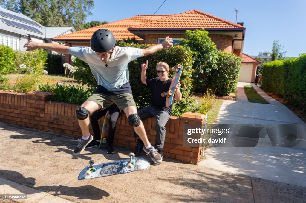 People Doing Skateboard Tricks on the Sidewalk