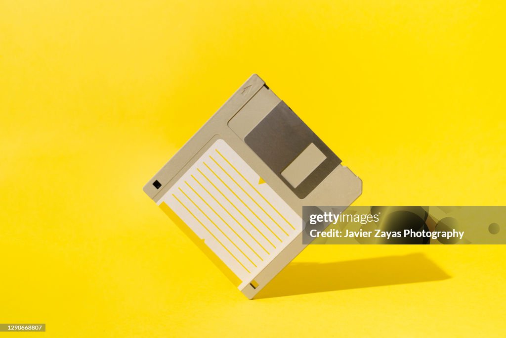Floppy Disk On Yellow Background