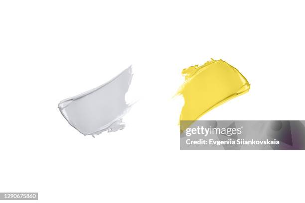 tender yellow and gray lipstick textures isolated on white background. - gray color swatches stock pictures, royalty-free photos & images