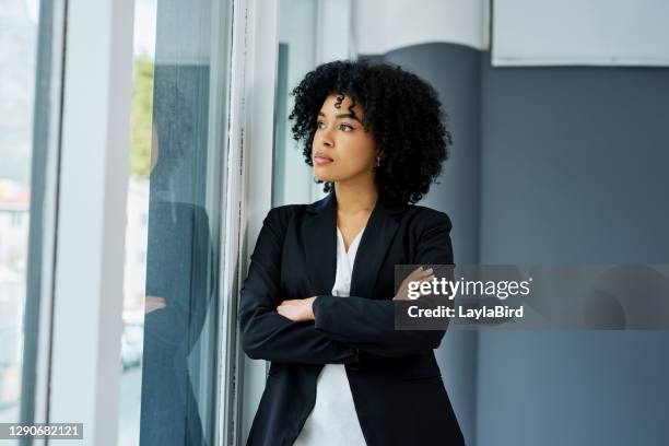 sailing away on dreams of success - woman in black suit stock pictures, royalty-free photos & images