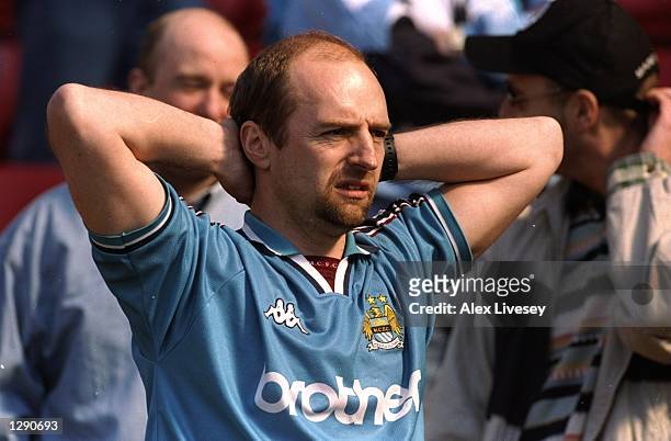 Manchester City fan is in despair at their relegation to Division Two despite winning in the Nationwide Division One match against Stoke City at the...