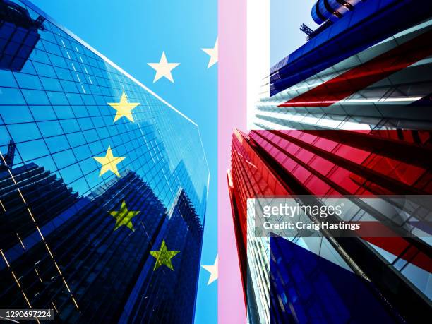 concept piece containing a city of london skyscraper scene with the union jack and eu flag overlaid as both the uk and eu try to negotiate a trade deal before brexit on the 1st january 2021 - brexit ストックフォトと画像