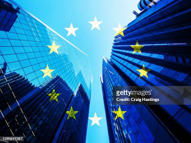 concept piece containing a city of london skyscraper scene with the eu flag overlaid as both the uk and eu try to negotiate a trade deal before brexit on the 1st january 2021 - world trade organisation stock pictures, royalty-free photos & images