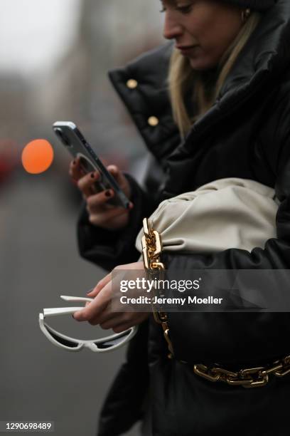 Sonia Lyson wearing Nanushka jacket, Bottega Veneta bag and the new IPhone 12 Pro Max on December 10, 2020 in Dusseldorf, Germany.