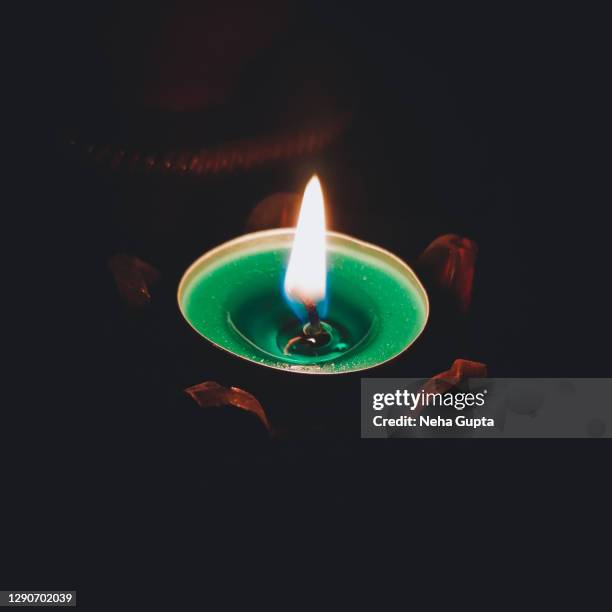 illuminated candle - festive season - ceremony fotografías e imágenes de stock