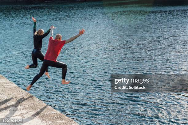 fun in cornwall! - old people diving stock pictures, royalty-free photos & images