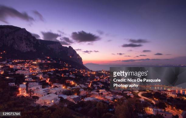 view of capri at sunset - isle of capri sunset stock pictures, royalty-free photos & images