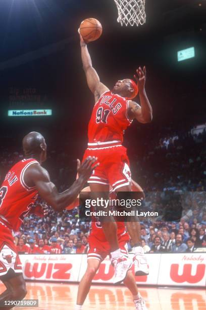 Dennis Rodman of the Chicago Bulls pulls down a rebound during a NBA basketball game against the Washington Bullets on April 1, 1996 at USAir Arena...