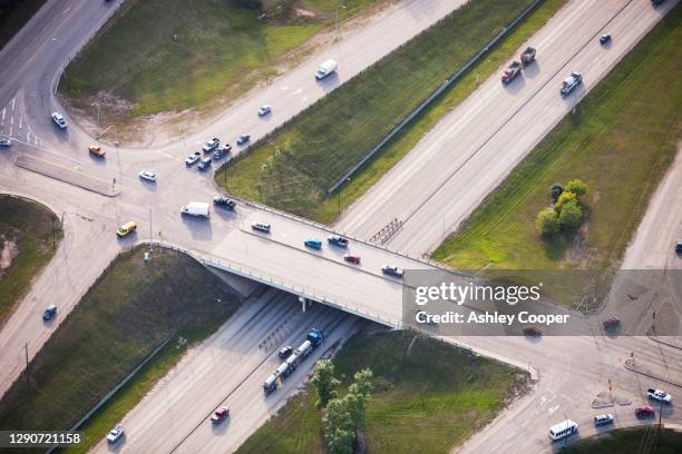 highway 63 in fort mcmurray which is the centre of the athabasca tar sands, the world's third largest oil reserves. - oil sands stock pictures, royalty-free photos & images