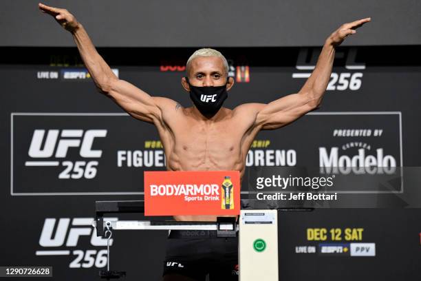Deiveson Figueiredo of Brazil poses on the scale during the UFC 256 weigh-in at UFC APEX on December 11, 2020 in Las Vegas, Nevada.