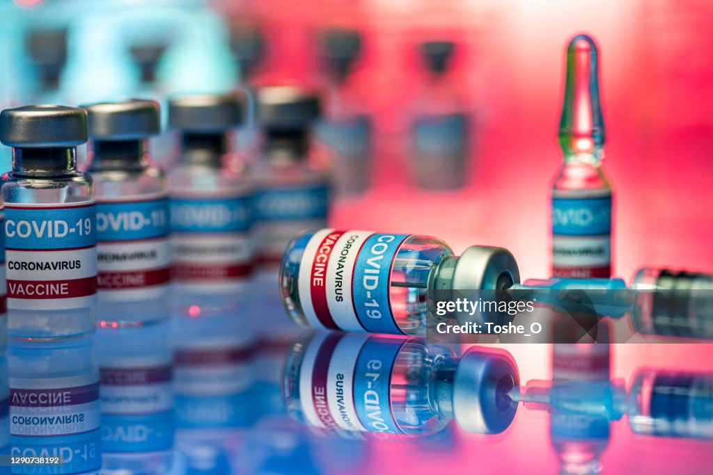 Close up of vials and syringe - Covid-19 vaccine research