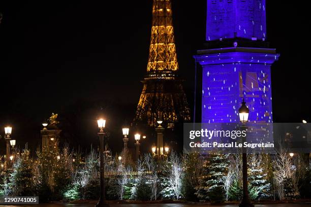 General view of the illuminated Place de la Concorde for Christmas and New Year celebrations, with the Eiffel Tower in the background. The Concorde...