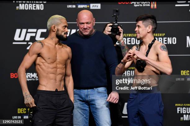 Deiveson Figueiredo of Brazil and Brandon Moreno of Mexico face off during the UFC 256 weigh-in at UFC APEX on December 11, 2020 in Las Vegas, Nevada.