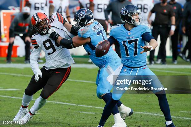 Adrian Clayborn of the Cleveland Browns rushes Ryan Tannehill of the Tennessee Titans at Nissan Stadium on December 06, 2020 in Nashville, Tennessee.