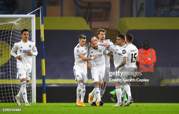 Mateusz Klich of Leeds United celebrates with team mates Ezgjan Alioski, Patrick Bamford, Raphinha and Stuart Dallas after scoring their sides first...