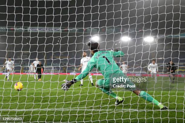 Mateusz Klich of Leeds United scores their sides first goal from the penalty spot past Lukasz Fabianski of West Ham United after VAR awarded a retake...