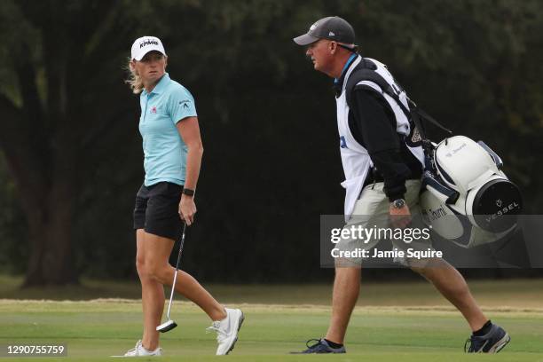 Stacy Lewis of the United States talks with her caddie, Travis Wilson, as they walk up the 18th fairway during the second round of the 75th U.S....