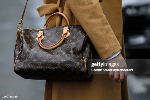 Light and dark brown speedy 30 monogram canvas bag by Louis Vuitton as a detail of german model and actress Victoria Jancke during a street style...