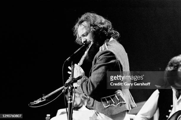 Scottish Rock musician Ian Anderson, of the group Jethro Tull, plays flute as he performs onstage, during the band's 'Heavy Horses' tour, at Madison...