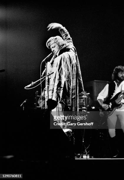 Scottish Rock musician Ian Anderson, of the group Jethro Tull, plays flute as he performs onstage, during the band's 'Heavy Horses' tour, at Madison...