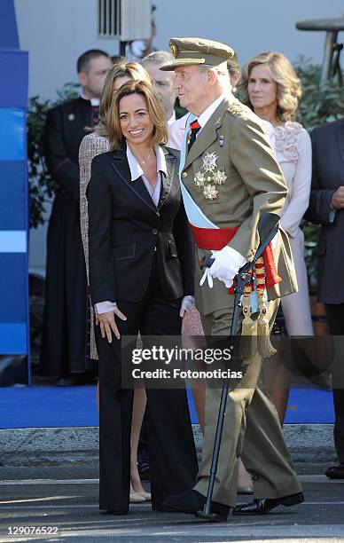 Minister Carme Chacon and King Juan Carlos of Spain attend The National Day Military Parade on October 12, 2011 in Madrid, Spain.