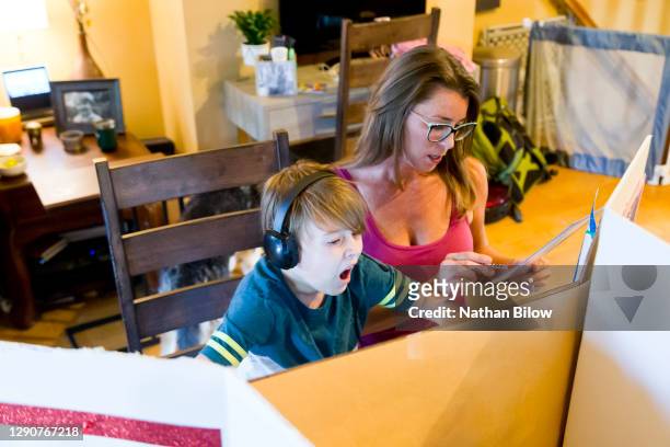 home schooling - yawning mother child stock pictures, royalty-free photos & images