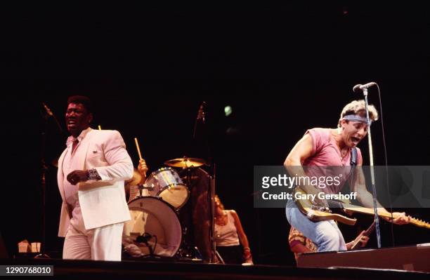 American Rock musicians Clarence Clemons of the E Street Band and Bruce Springsteen, on guitar, perform onstage during the 'Born in the USA' tour, at...