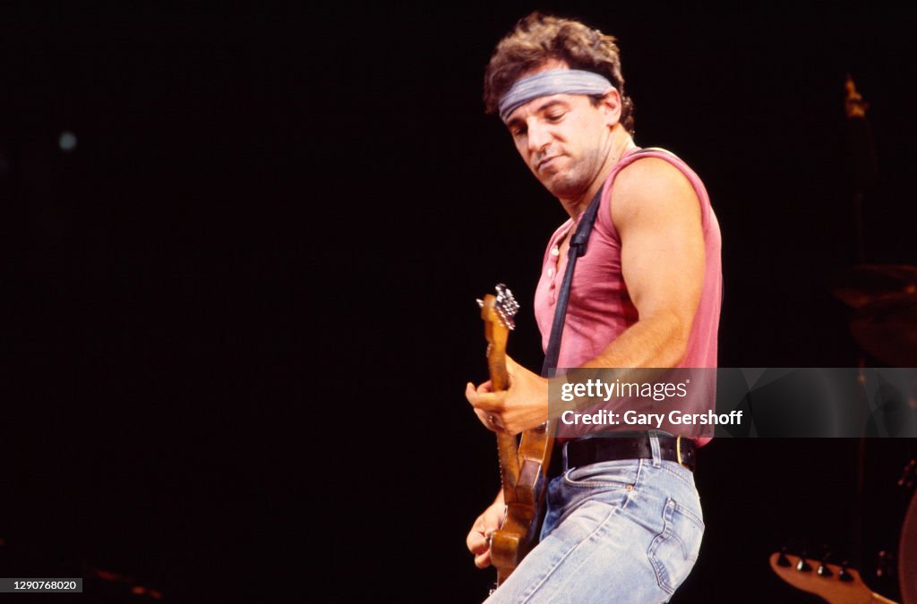 Bruce Springsteen Performance American Rock musician Bruce Springsteen plays guitar as he performs ...