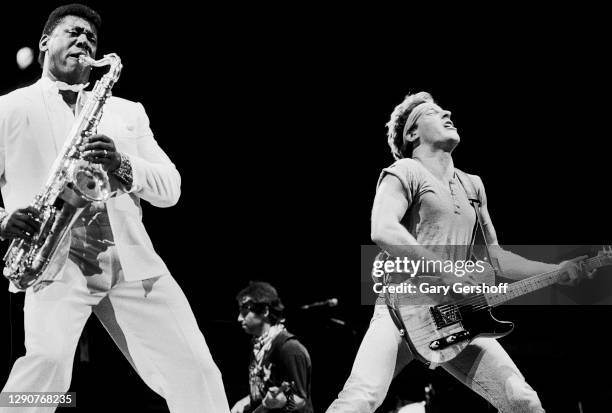 American Rock musicians Clarence Clemons of the E Street Band, on saxophone, and Bruce Springsteen, on guitar, perform onstage during the 'Born in...