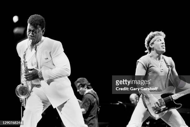 American Rock musicians Clarence Clemons of the E Street Band, on saxophone, and Bruce Springsteen, on guitar, perform onstage during the 'Born in...