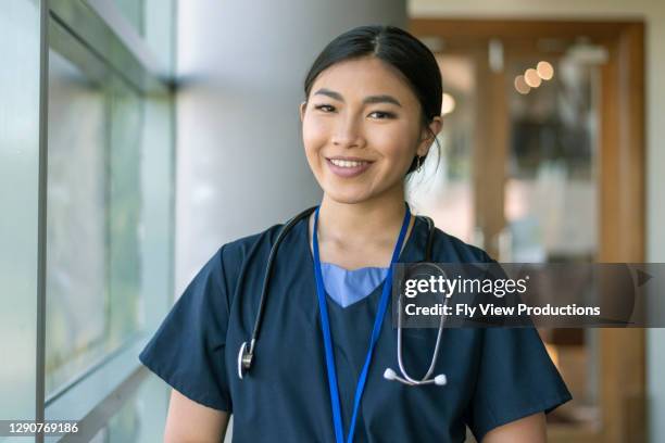 female doctor of asian descen - nurses stock pictures, royalty-free photos & images