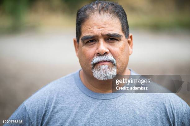 mature mexican man portrait - fat stock pictures, royalty-free photos & images