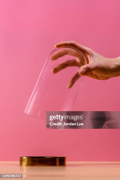 hand holding bell jar - the dome stock pictures, royalty-free photos & images