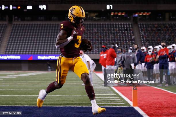Running back Rachaad White of the Arizona State Sun Devils scores on a 2-yard rushing touchdown against the Arizona Wildcats during the second half...