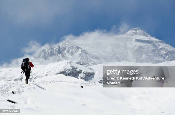 man climbing up mountain at mt. everest - climbing snow mountain stock pictures, royalty-free photos & images