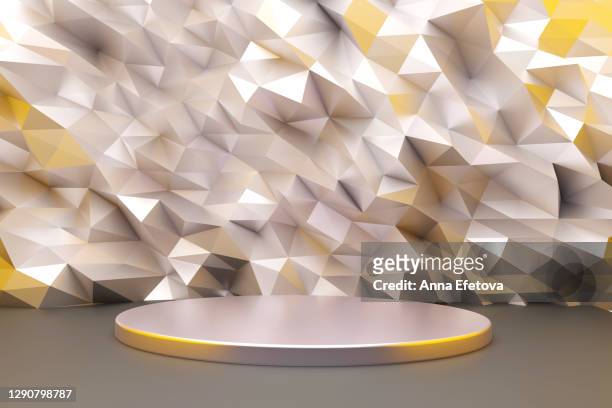 silver podium on crumpled metallic gray background with yellow color. trendy colors of the year - champions awards ceremony fotografías e imágenes de stock