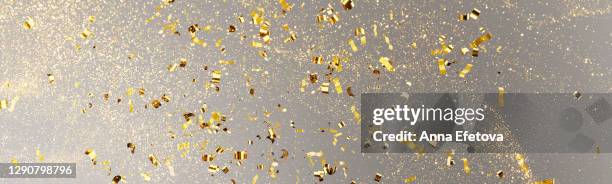 holiday glittering background in trendy colors of the year - confetti gold ストックフォトと画像