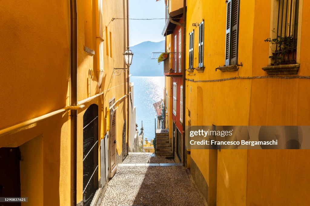Colourful narrow alley in the old town of Varenna