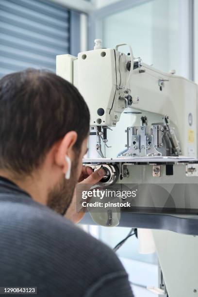 industrial sewing machine repairing - needle plant part stock pictures, royalty-free photos & images