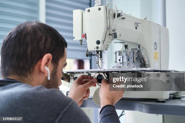 industrial sewing machine repairing - needle plant part stock pictures, royalty-free photos & images