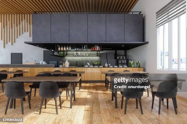 modernes restaurant-interieur mit offener küche, schwarzen stühlen, holztischen und parkettboden. - restaurant background stock-fotos und bilder
