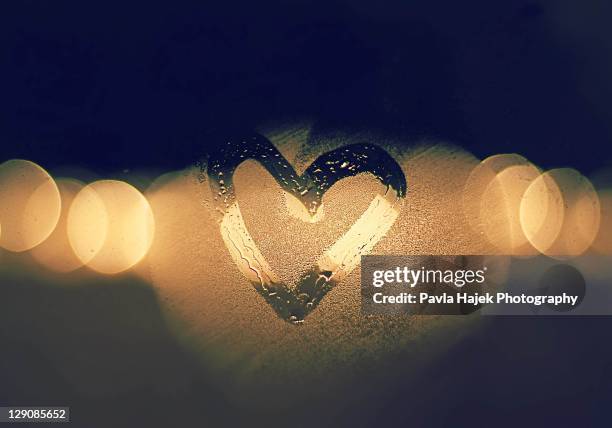 heart drawn with warm breath on cold window - mirror steam stock pictures, royalty-free photos & images