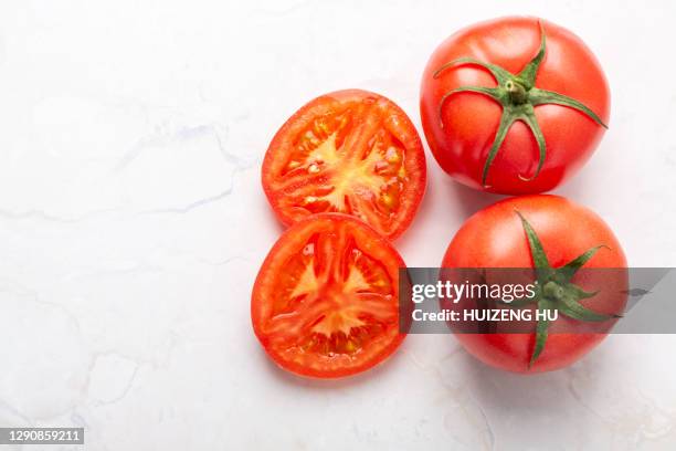 fresh tomatoes - chopped stock pictures, royalty-free photos & images