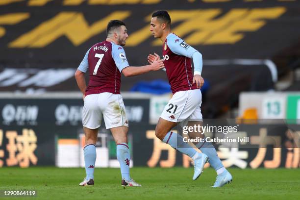 Anwar El Ghazi of Aston Villa celebrates with teammate John McGinn after scoring his team's first goal during the Premier League match between...