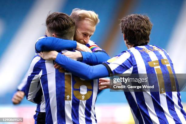 Josh Windass of Sheffield Wednesday celebrates with team mates Barry Bannan and Adam Reach after scoring their side's first goal during the Sky Bet...