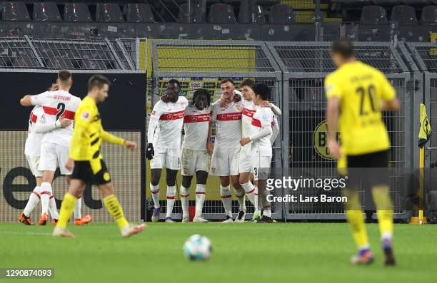 Philipp Foerster of VfB Stuttgart celebrates with teammates after scoring their team's third goal during the Bundesliga match between Borussia...